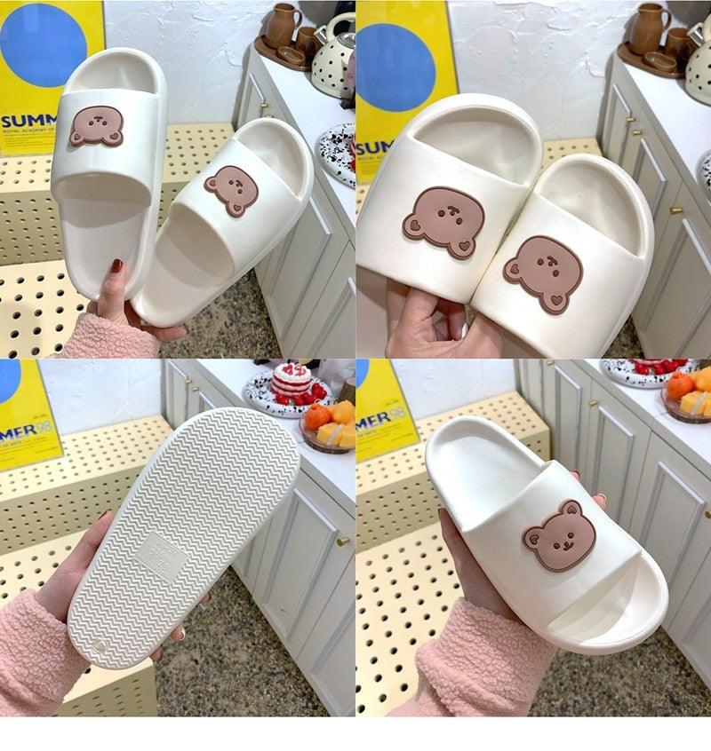 Unisex white thick-sole sandals by Stevvex with brown bear-face emblem, pair on Tampa Home & Garden Store