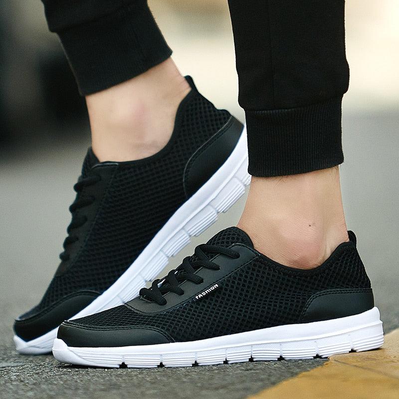 Stevvex unisex black mesh sneakers lace-up white sole lightweight casual walking shoes pair on Tampa Home & Garden Store