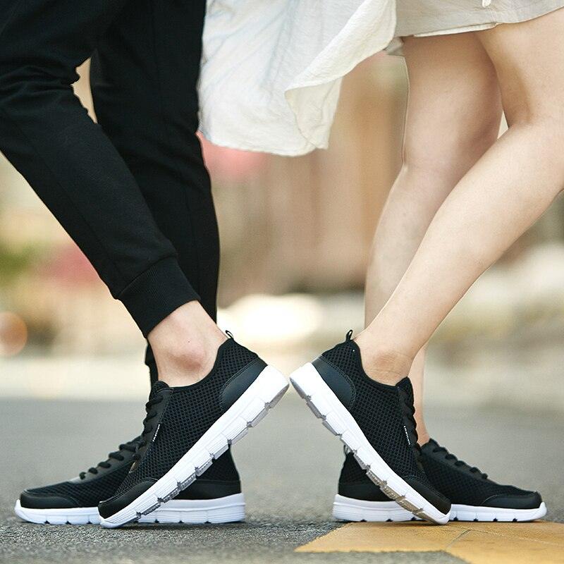 Unisex Stevvex breathable mesh sneakers black with white sole laceup casual walking shoes pairs on Tampa Home & Garden Store