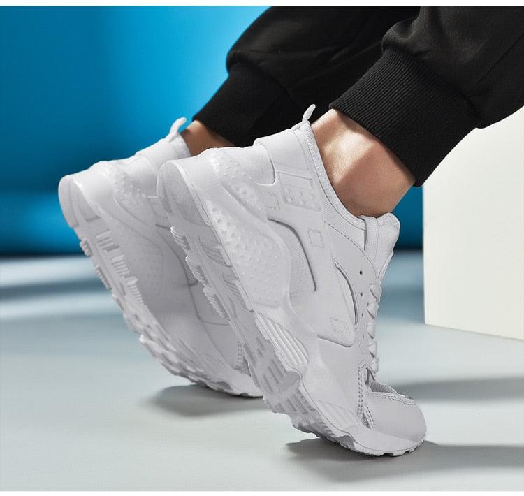 Pair of white Stevvex sneakers ST85SH5788WBO with chunky sole and breathable mesh upper on Tampa Home & Garden Store