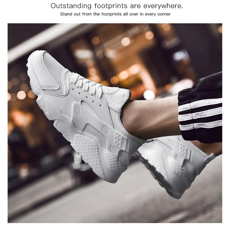 Pair of white mesh sneakers with a chunky sole for running and casual wear on Tampa Home & Garden Store