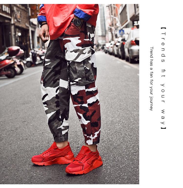 Unisex sneakers with red athletic style on a busy city street on Tampa Home & Garden Store