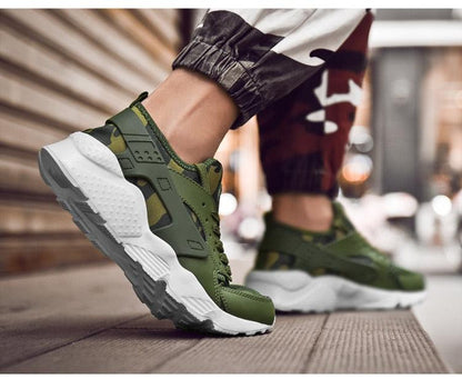 Camouflage green sneakers with a white chunky sole, lace-up athletic trainers on Tampa Home & Garden Store
