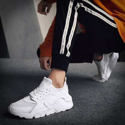Unisex white sneakers Stevvex with mesh upper and chunky white sole on Tampa Home & Garden Store
