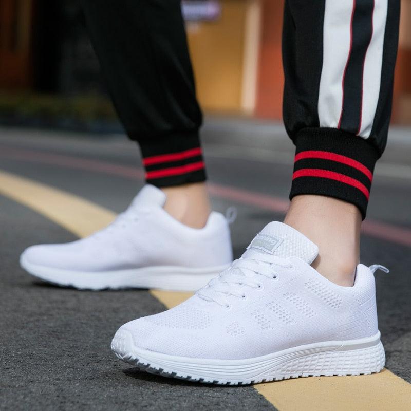 Sneakers Stevvex white mesh athletic shoes with breathable knit upper and cushioned sole on Tampa Home & Garden Store