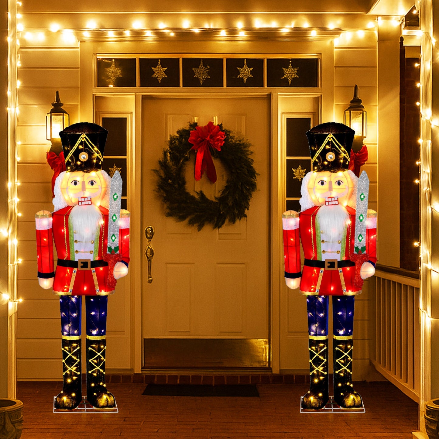 Set of 2 5 ft outdoor nutcrackers with glitter swords, red uniforms, illuminated by lights on Tampa Home & Garden Store