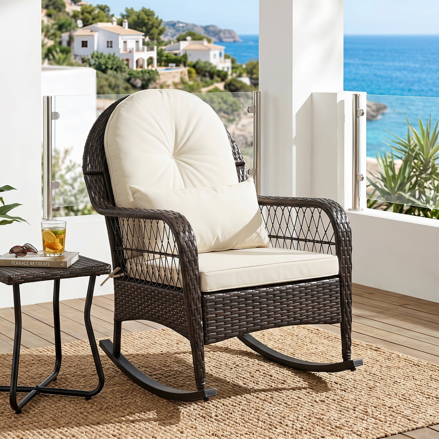 Outdoor wicker rocking chair with cream cushions on a balcony, dark brown frame on Tampa Home & Garden Store