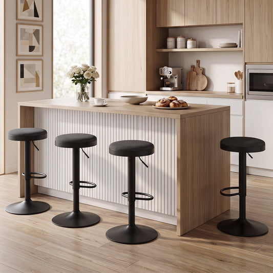 Four adjustable bar stools with padded black seats and metal pedestals around a wooden kitchen island on Tampa Home & Garden Store