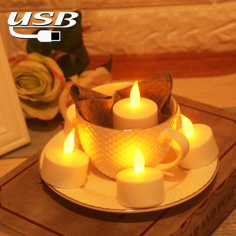 USB rechargeable flameless LED tea lights with warm yellow glow around a white teacup on a plate on Tampa Home & Garden Store