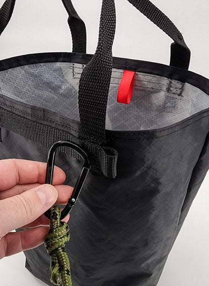 Utility Tote 32L ECOPAK by Hilltop Packs LLC in black with rugged top handles and carabiner with camo paracord leash on Tampa Home & Garden Store
