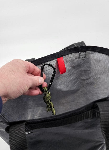 Utility Tote 32L ECOPAK, black exterior with gray interior, carabiner on olive paracord inside on Tampa Home & Garden Store