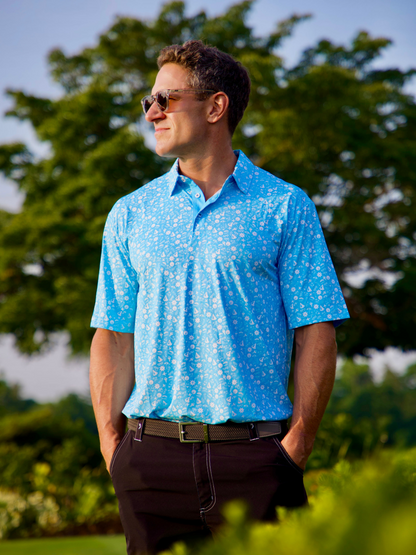 Vacation Performance Polo by White Water Life, light blue polo with white pattern worn outdoors on Tampa Home & Garden Store