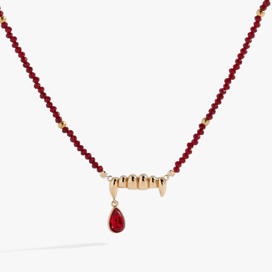Vampire Teeth Fangs Pendant necklace with red faceted beads and gold-tone fang centerpiece on Tampa Home & Garden Store