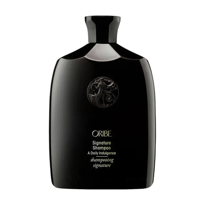 Oribe Signature Shampoo bottle black glossy plastic with embossed crest and gold lettering on Tampa Home & Garden Store