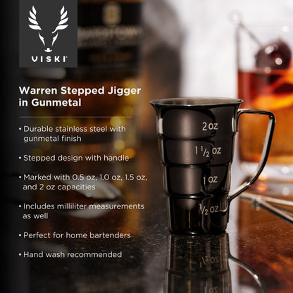 Gunmetal Viski stepped jigger with etched measurements (2 oz to 1/2 oz) on a bar backdrop on Tampa Home & Garden Store