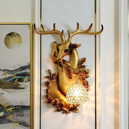 Gold deer crystal sconce with resin deer head and floral accents on Tampa Home & Garden Store