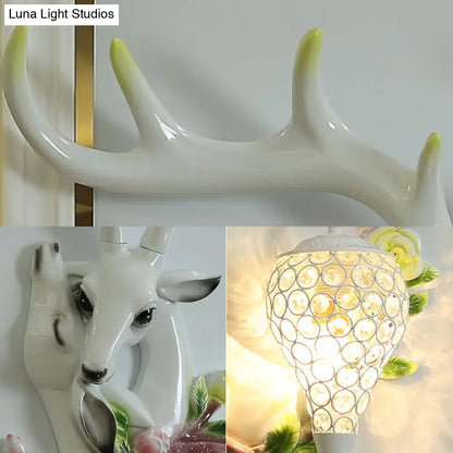 Resin deer head wall sconce with crystal disc shade white body gold antler tips Decorbites on Tampa Home & Garden Store