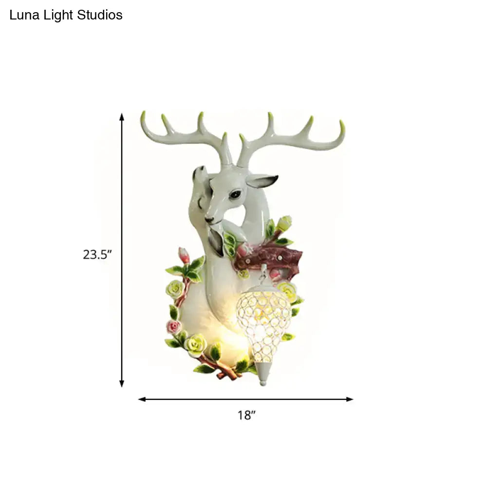 Decorbites gold deer crystal sconce resin deer head with floral surround and lit lantern on Tampa Home & Garden Store