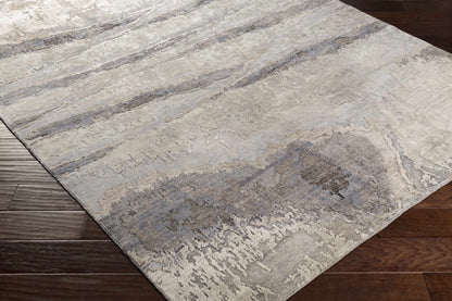 Vincentown Area Rug by Boutique Rugs in gray ivory abstract pattern on wood floor on Tampa Home & Garden Store