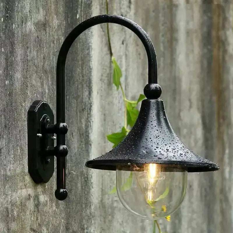 Vintage black metal outdoor wall lamp with clear glass shade by Decorbites on Tampa Home & Garden Store