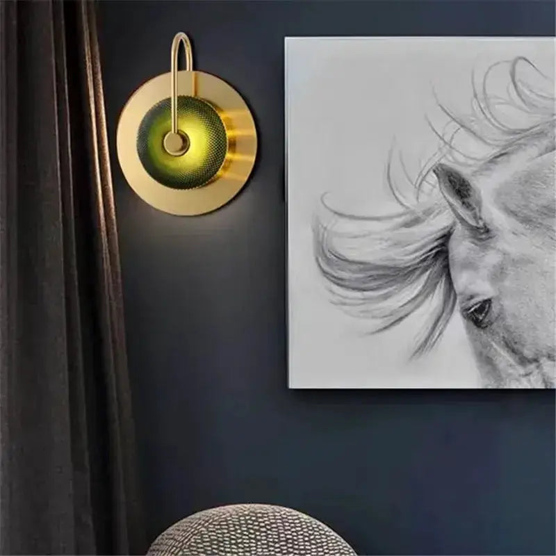 Vintage brass wall light with green glass centerpiece, round sconce by Decorbites on dark wall on Tampa Home & Garden Store