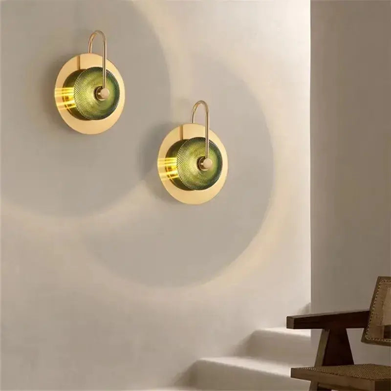 Pair of vintage brass wall lights with green glass centers and curved hangers by Decorbites on Tampa Home & Garden Store