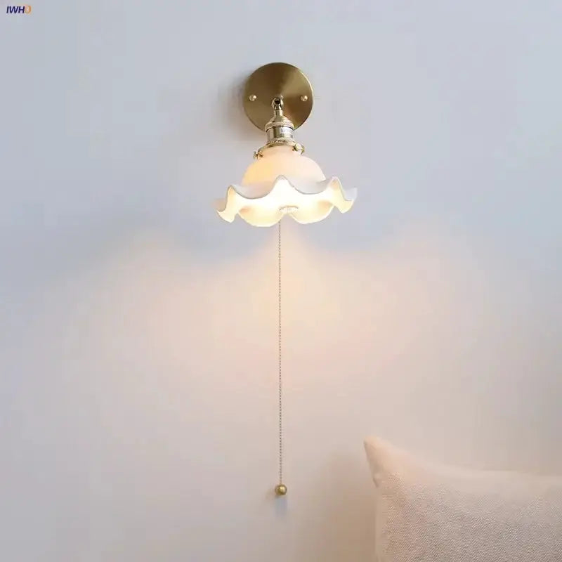 Vintage brass wall sconce with a ruffled frosted glass shade, pull-chain LED on Tampa Home & Garden Store