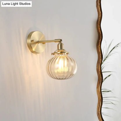 Vintage brass wall light with champagne and clear glass shade, Decorbites wall sconce on Tampa Home & Garden Store