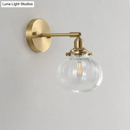 Vintage brass wall light by Decorbites with champagne and clear glass shade for bedroom on Tampa Home & Garden Store