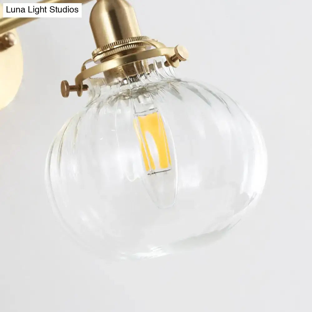 Vintage brass wall light with champagne and clear glass globe shade by Decorbites on Tampa Home & Garden Store