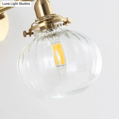 Vintage brass wall light with champagne and clear glass globe shade by Decorbites on Tampa Home & Garden Store