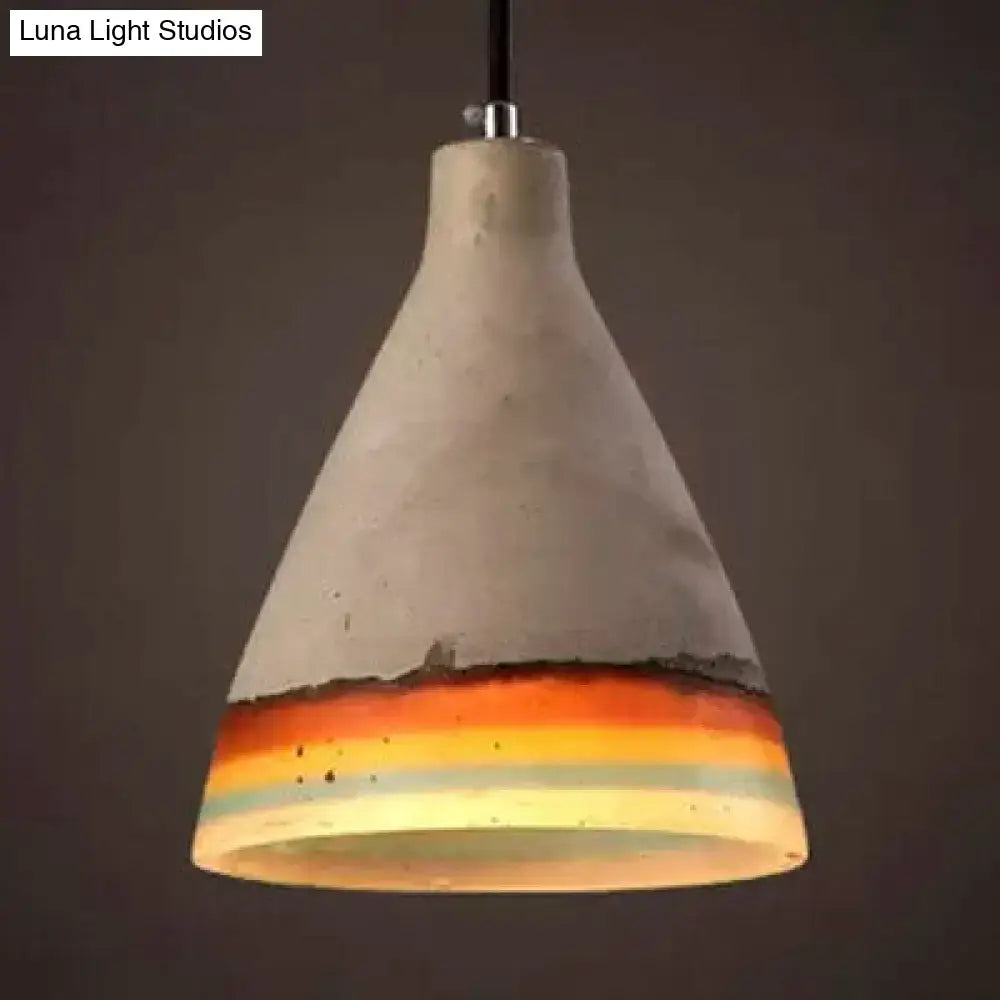 Conic pendant light with a concrete finish and a colorful bottom band in orange and blue on Tampa Home & Garden Store