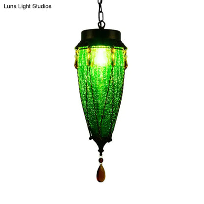 Vintage emerald green glass pendant light with amber bead accents, lantern-style hanging fixture on Tampa Home & Garden Store