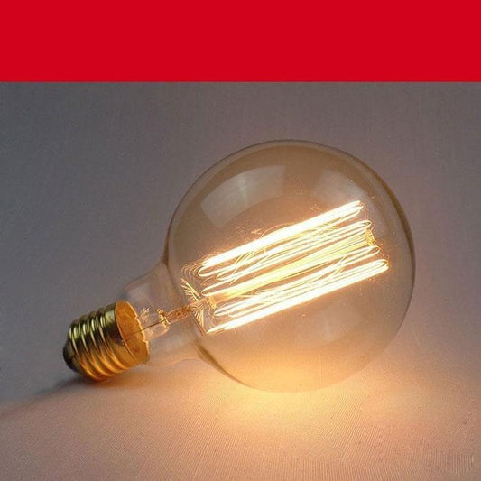 Stevvex vintage Edison incandescent bulb with clear glass and warm amber glow, dimmable on Tampa Home & Garden Store