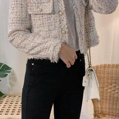 Stevvex cream tweed jacket with fringe hems and pearl buttons, long sleeves, with black pants on Tampa Home & Garden Store