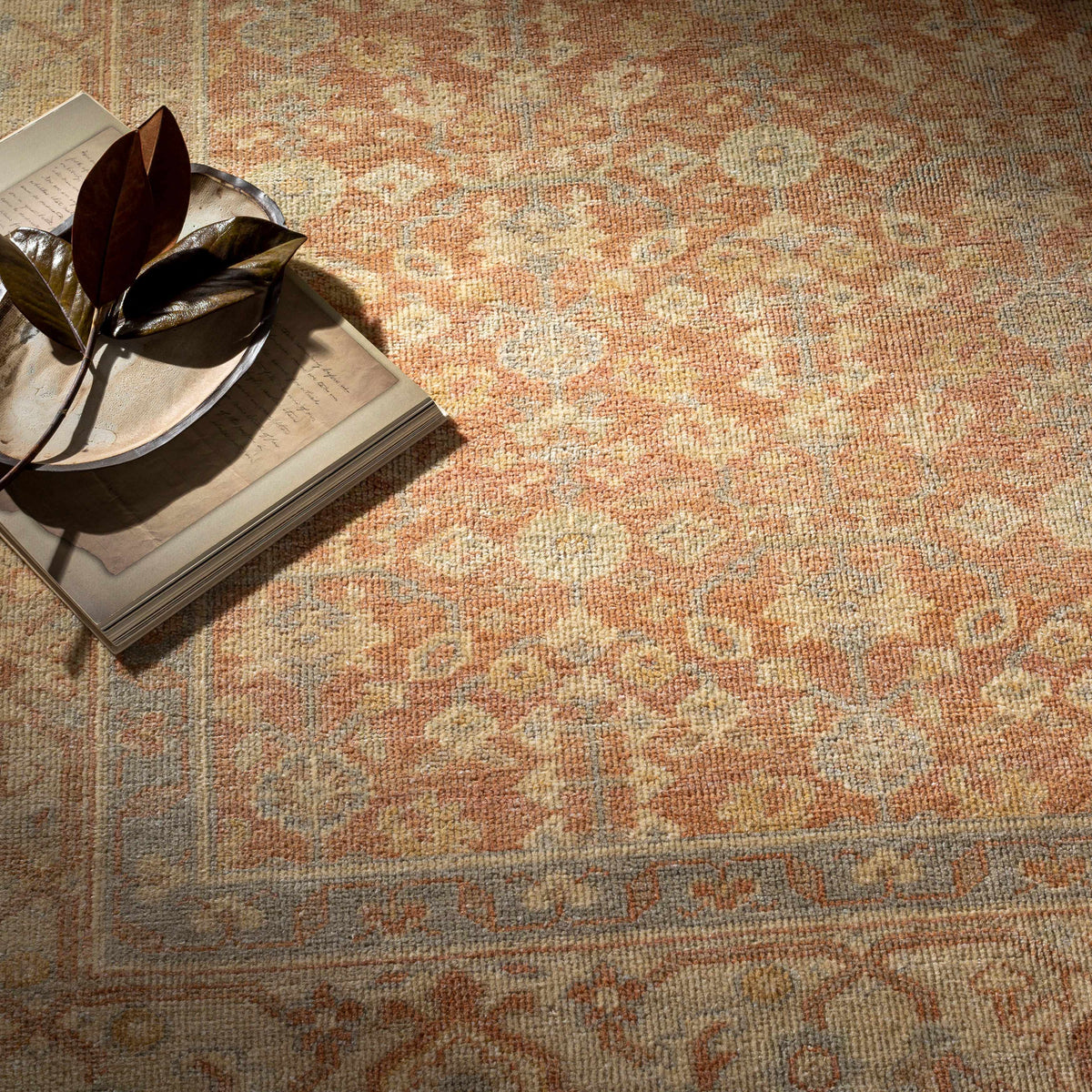 Wailea Area Rug by Boutique Rugs in warm orange and cream vintage medallion pattern on Tampa Home & Garden Store