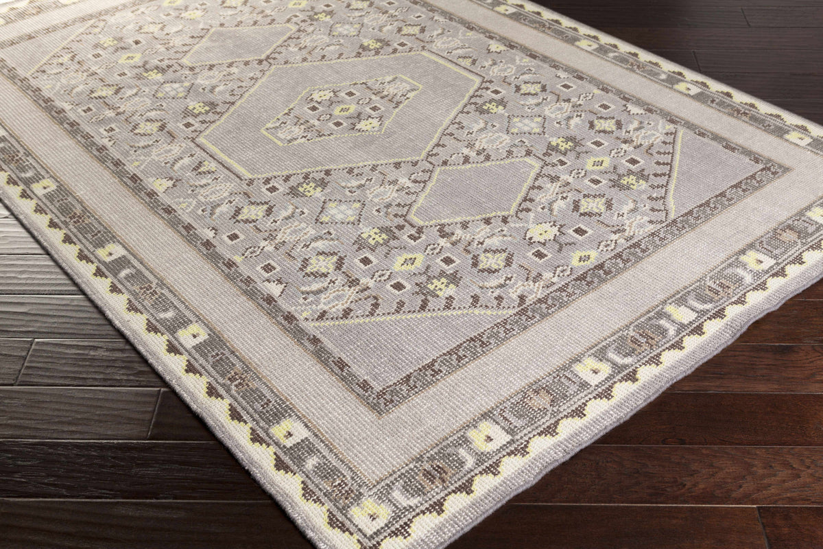 Walden Area Rug by Boutique Rugs in soft gray-beige with pale yellow accents and geometric border on Tampa Home & Garden Store