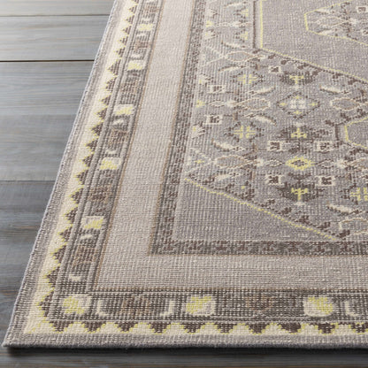 Walden Area Rug from Boutique Rugs in muted beige with brown border and yellow accents on Tampa Home & Garden Store