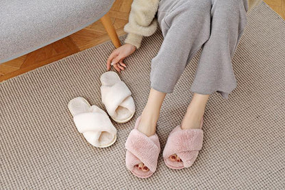 Stevvex women's fluffy faux fur cross-band slippers pink open-toe; white pair nearby on beige rug on Tampa Home & Garden Store
