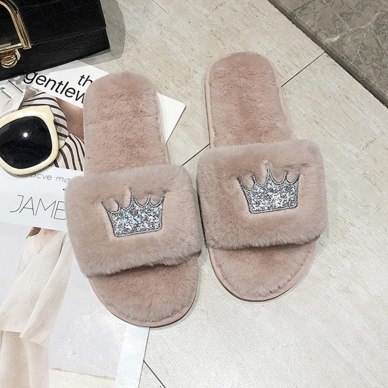 Women's pink fluffy faux fur slippers with open toe design and glitter crown patch on Tampa Home & Garden Store