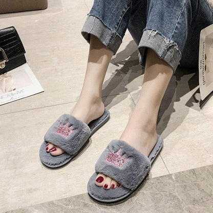 Women's plush grey faux fur slippers with crown patch and memory foam sole for indoor wear on Tampa Home & Garden Store