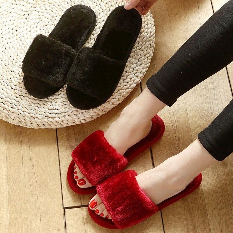 Stevvex women's fluffy faux fur slippers, red worn and black on rug, indoor slippers on Tampa Home & Garden Store