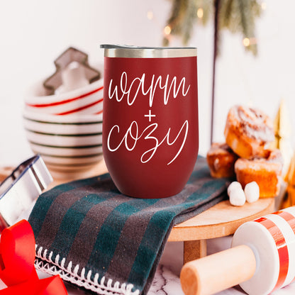 Gia Roma Warm + Cozy 17oz tumbler in red with a silver lid, festive kitchen scene on Tampa Home & Garden Store