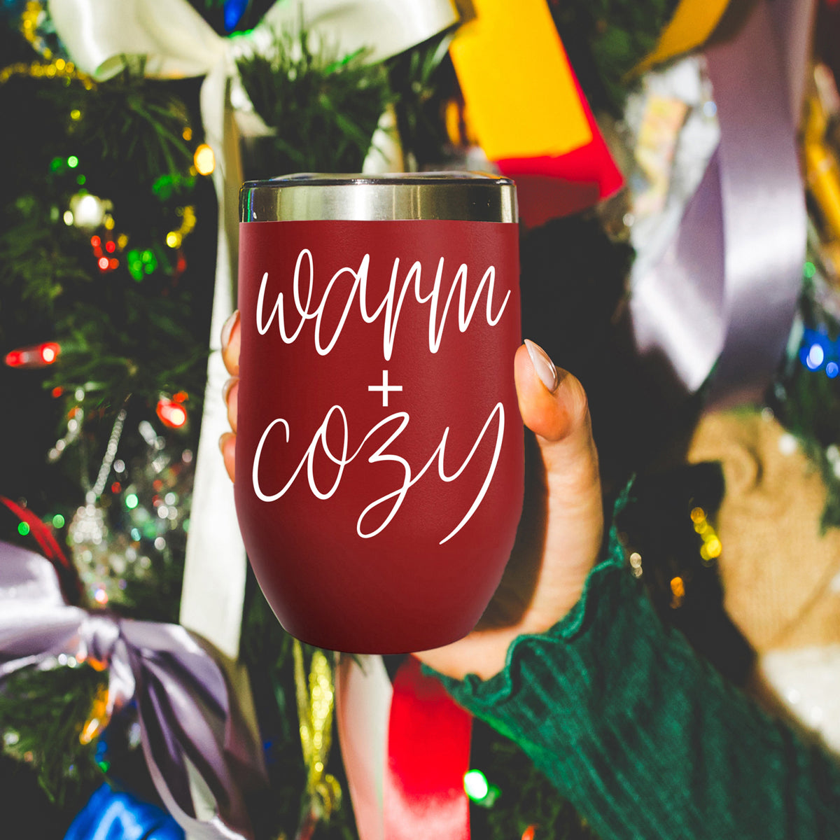 Gia Roma warm + cozy 17oz tumbler red stainless steel with white script, held by hand on Tampa Home & Garden Store