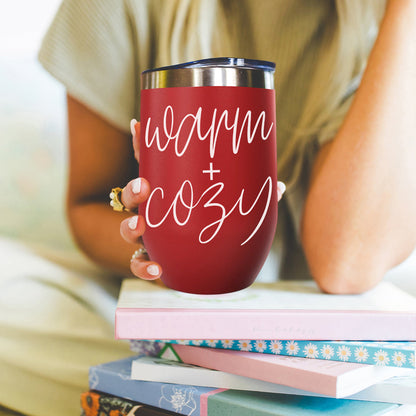 Warm + Cozy 17oz Gia Roma tumbler in red with white script, stainless steel lid, held in hand on Tampa Home & Garden Store