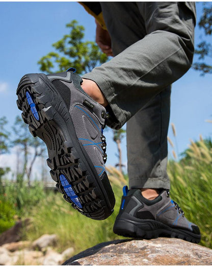 Waterproof hiking boots by Stevvex, grey/black with blue accents, rugged slip-resistant outsole on Tampa Home & Garden Store