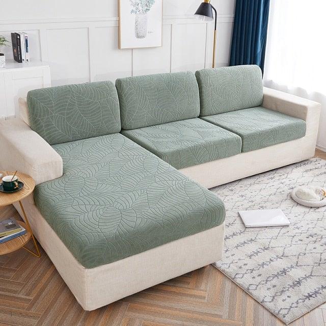 Stevvex Waterproof Seaters Cushion Sofa Seat Cover with green quilted cushions on beige sofa on Tampa Home & Garden Store