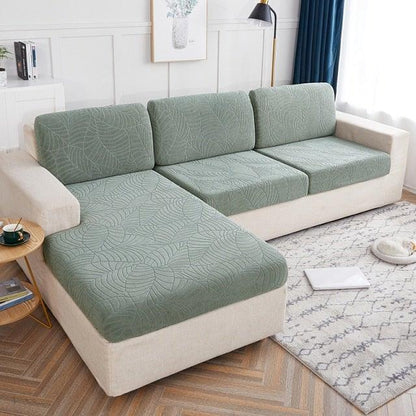 Stevvex Waterproof Seaters Cushion Sofa Seat Cover with green quilted cushions on beige sofa on Tampa Home & Garden Store