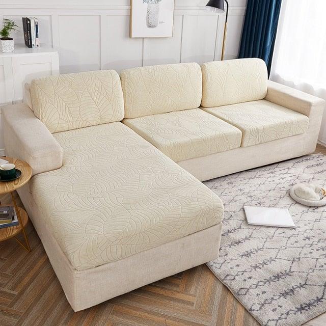 Stevvex Waterproof Sofa Seat Cover on beige sectional with chaise in living room on Tampa Home & Garden Store
