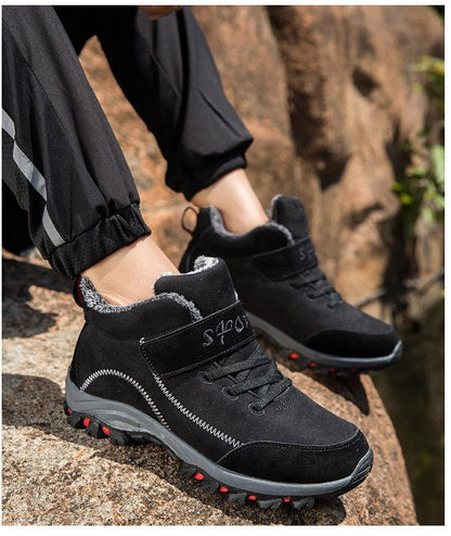 Stevvex waterproof winter boots pair, black fur-lined high-top with rugged sole and red accents on Tampa Home & Garden Store